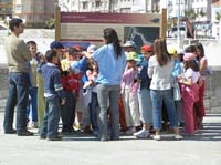 Pupils listening to an explanation in the port
